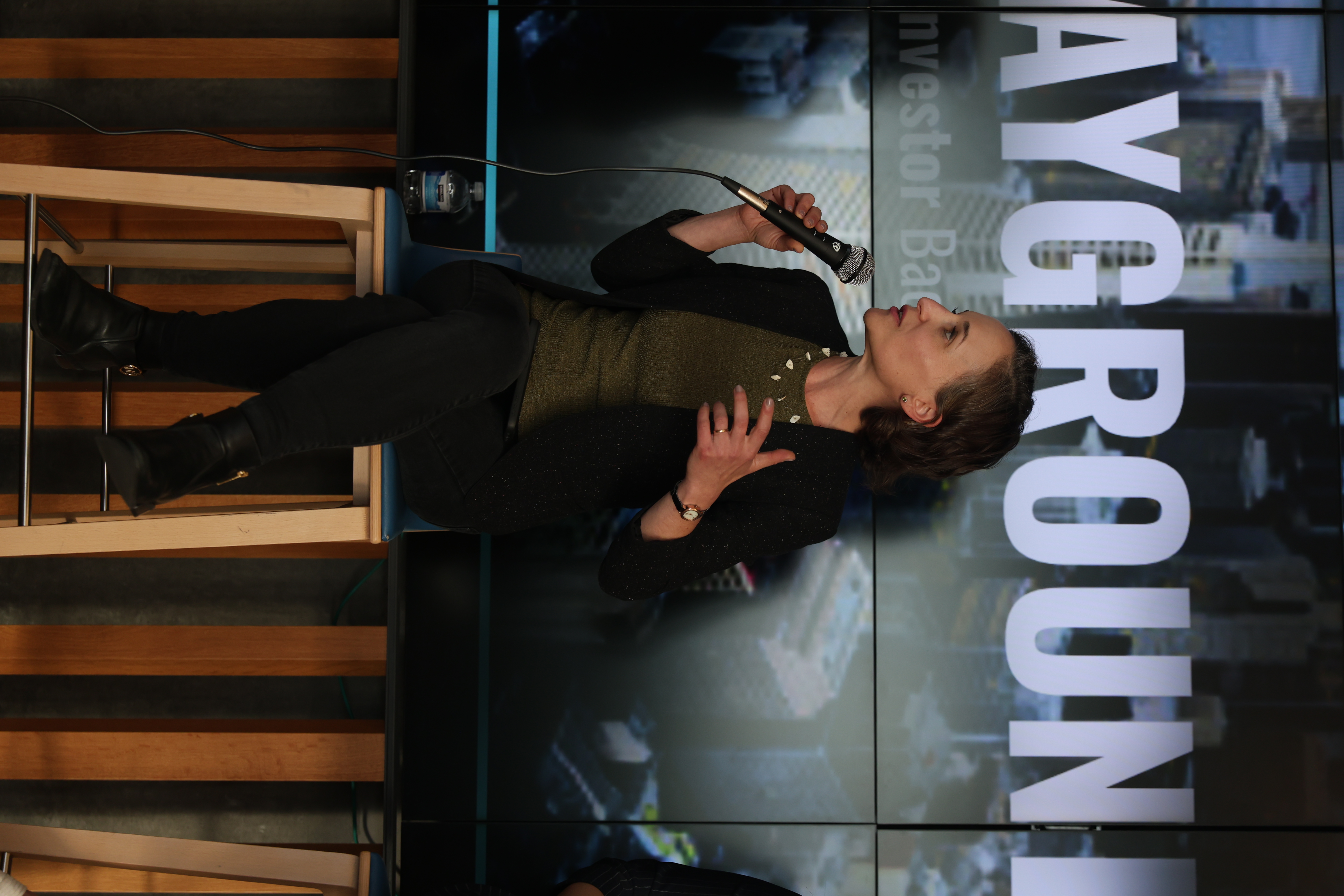 Founder speaking with guests at an evening event